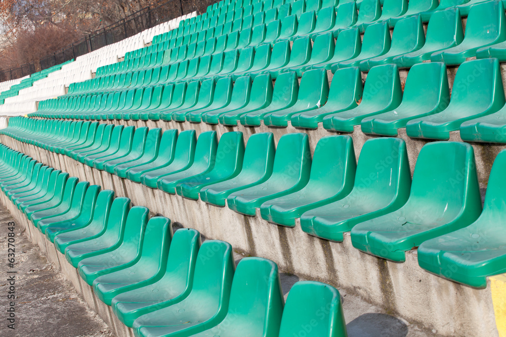 Fototapeta premium empty plastic seats on football stadium