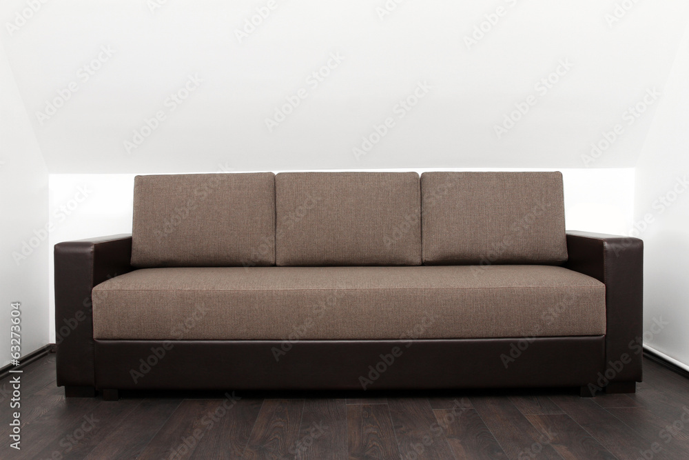 brown couch in bright white interior brown couch in bright white interior