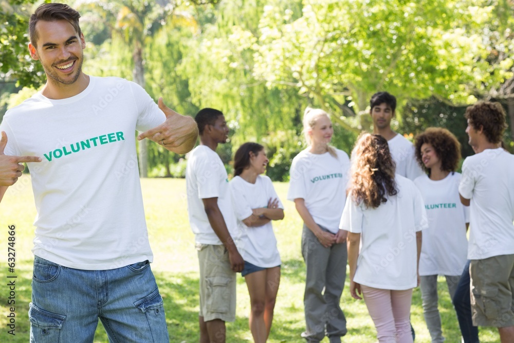 Handsome volunteer pointing at tshirt