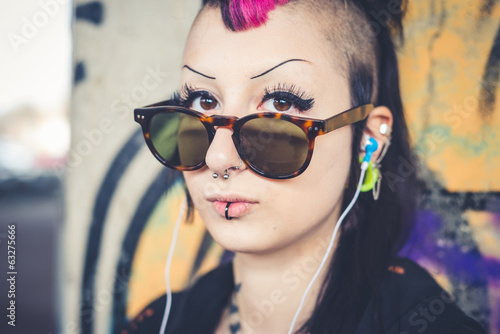 Portrait of young woman listening to music