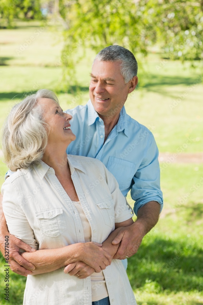 Loving and happy mature couple at park
