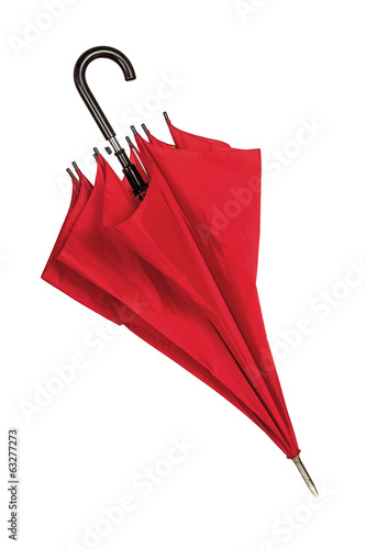 Closed red umbrella over white