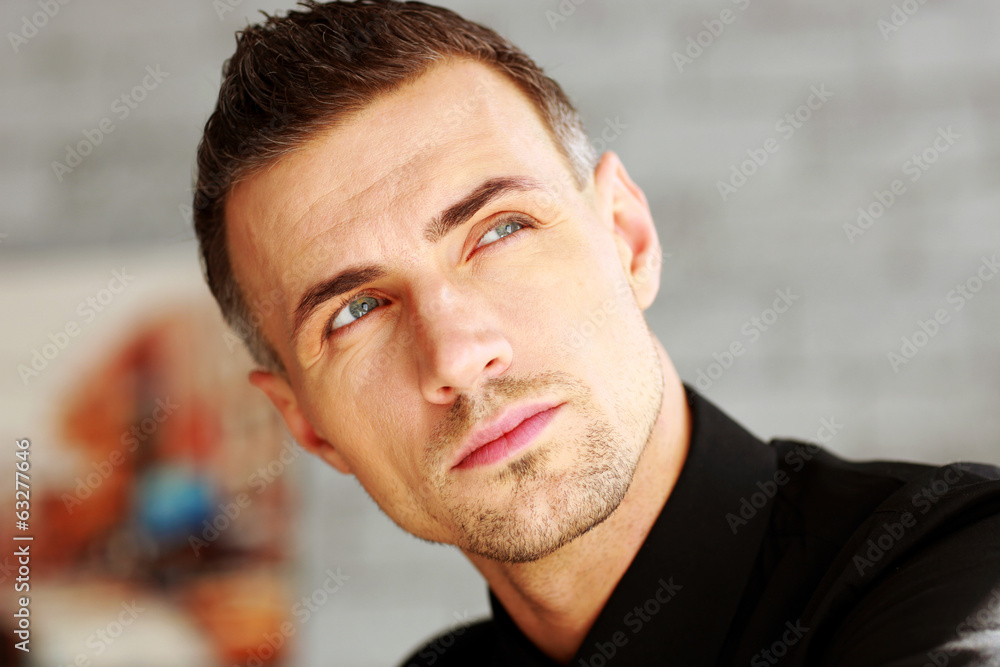 Fototapeta premium Closeup portrait of a businessman looking up
