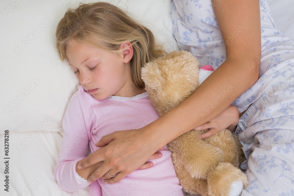 Girl and mother sleeping peacefully with stuffed toy in bed Girl and mother sleeping peacefully with stuffed toy in bed