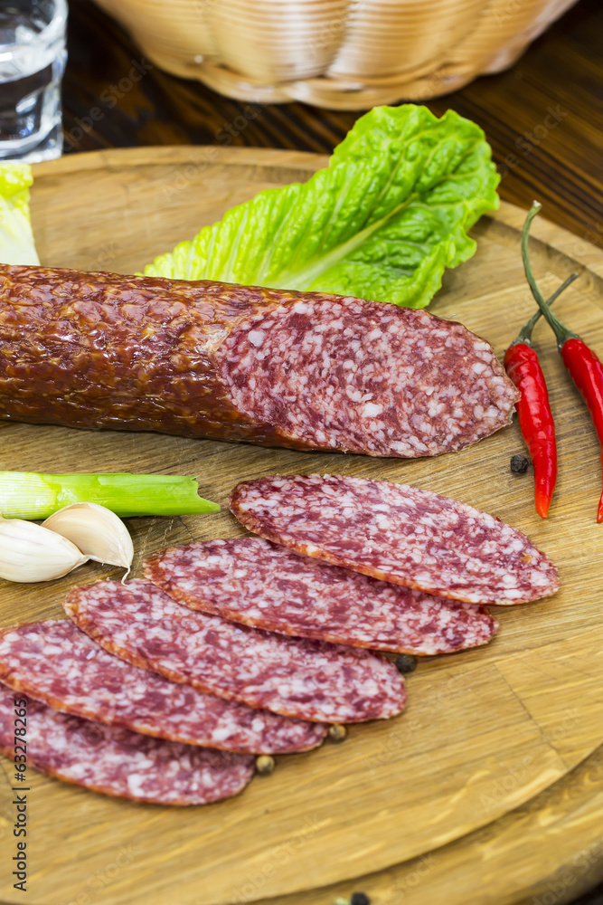sausage on a wooden plate in a restaurant sausage on a wooden plate in a restaurant