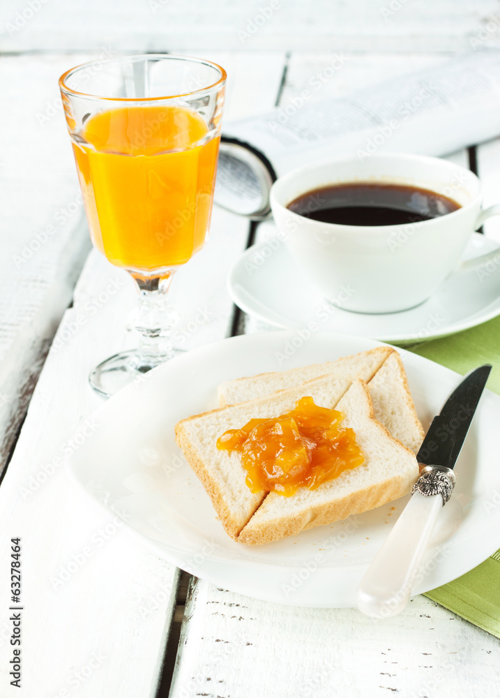 Continental breakfast - coffee, orange juice, toast Continental breakfast - coffee, orange juice, toast