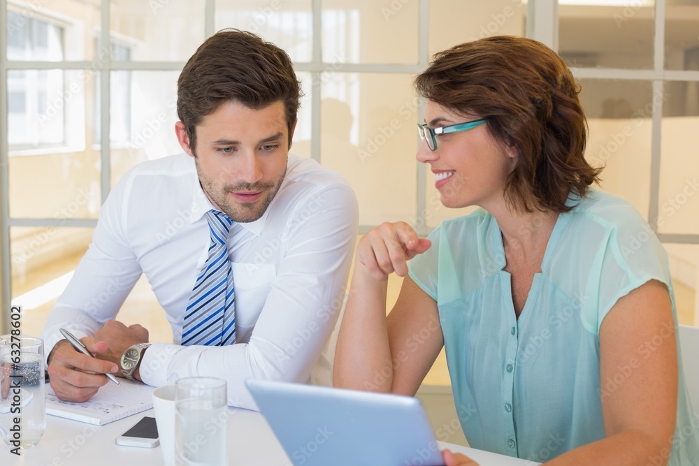 Fototapeta premium Business people looking at digital tablet in office