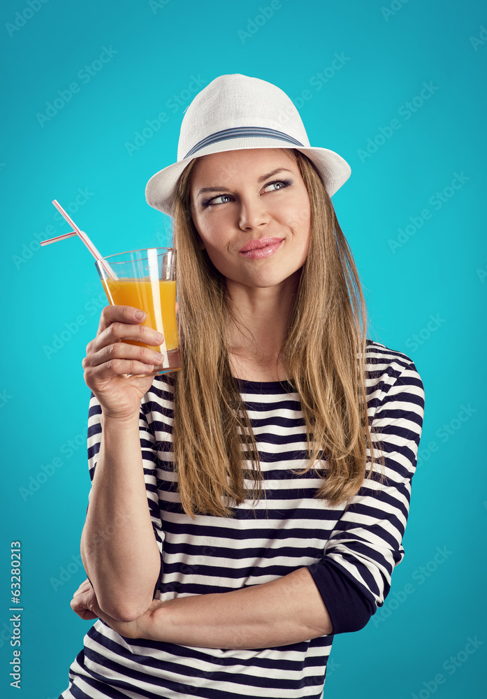 Pretty girl in hat standing with juice thinking of vacation Pretty girl in hat standing with juice thinking of vacation
