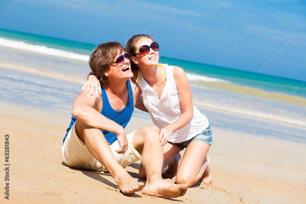 portrait of happy young couple in sunglasses in bright clothes portrait of happy young couple in sunglasses in bright clothes