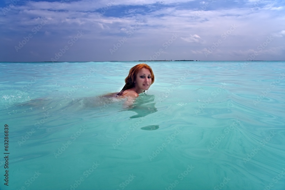 woman swims in sea