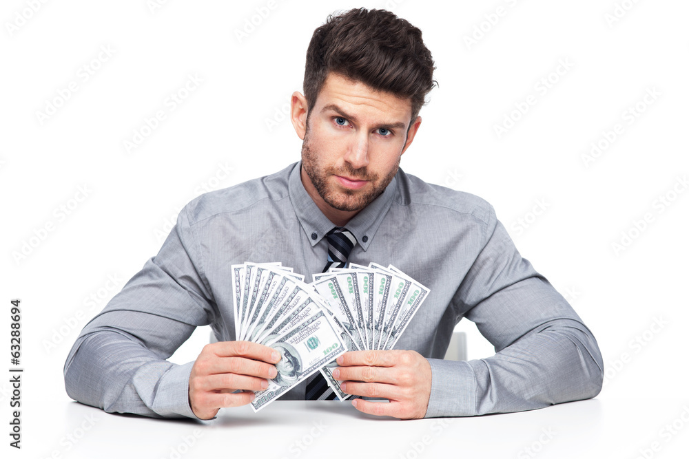 © pikselstock - Man holding money © pikselstock - Man holding money