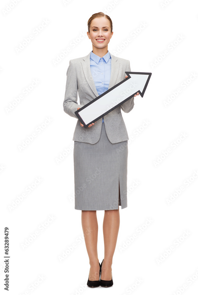 smiling businesswoman with direction arrow sign smiling businesswoman with direction arrow sign