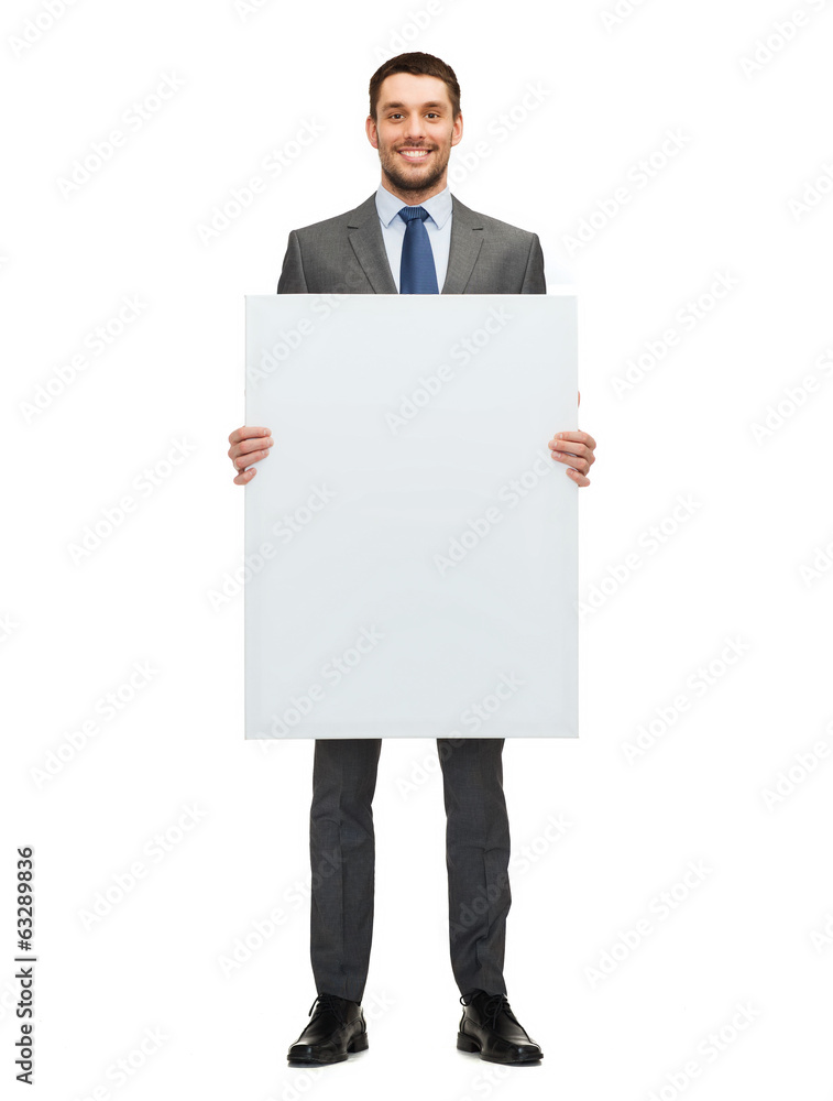 smiling businessman with white blank board smiling businessman with white blank board