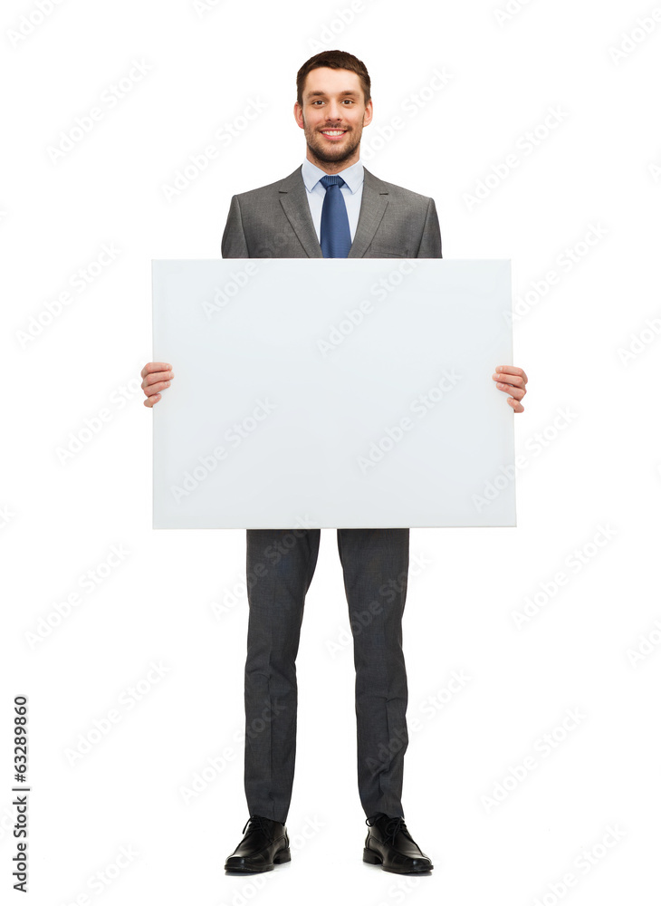 smiling businessman with white blank board smiling businessman with white blank board