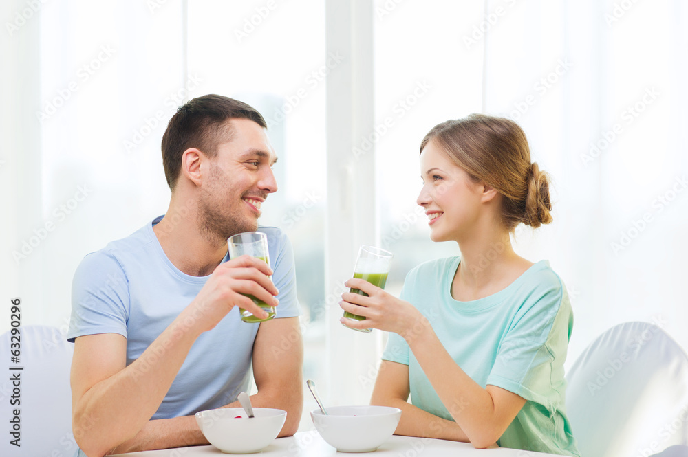 smiling couple having breakfast at home smiling couple having breakfast at home