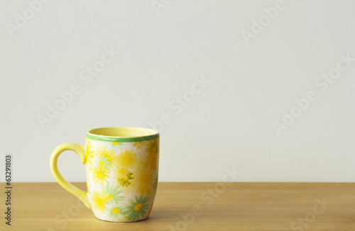 Mug/cup on wood table and white background