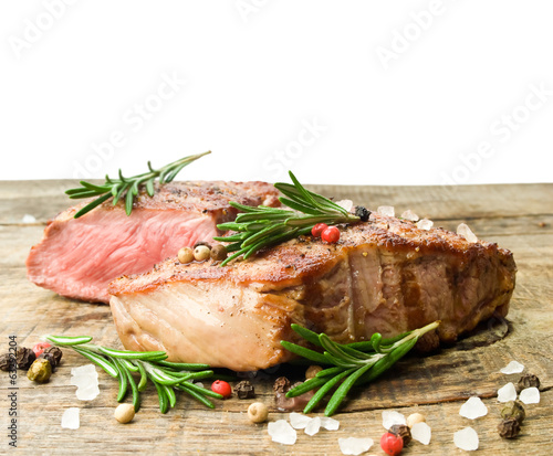 Beef steak on a wooden table.