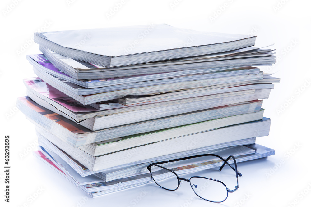 magazine and book stack with glasses magazine and book stack with glasses