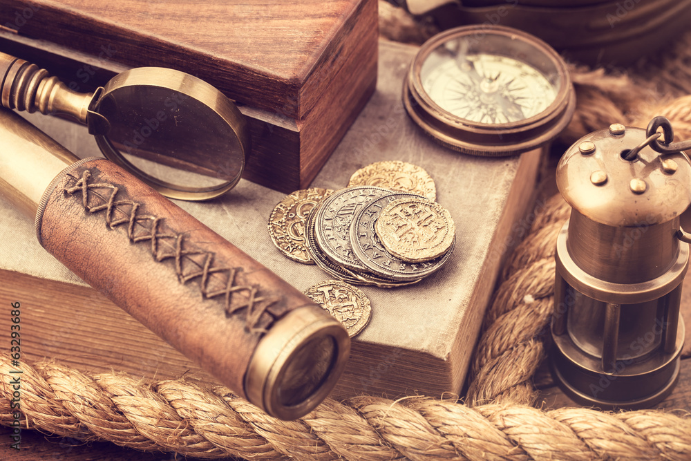 Old coins and nautical accessories