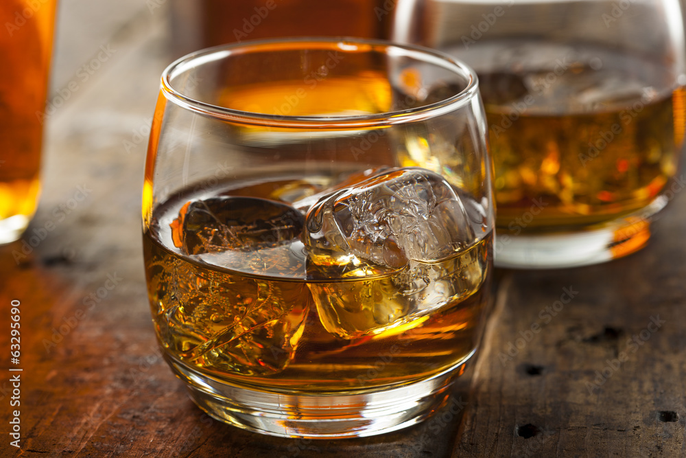 Alcoholic Whiskey Bourbon in a Glass with Ice Alcoholic Whiskey Bourbon in a Glass with Ice