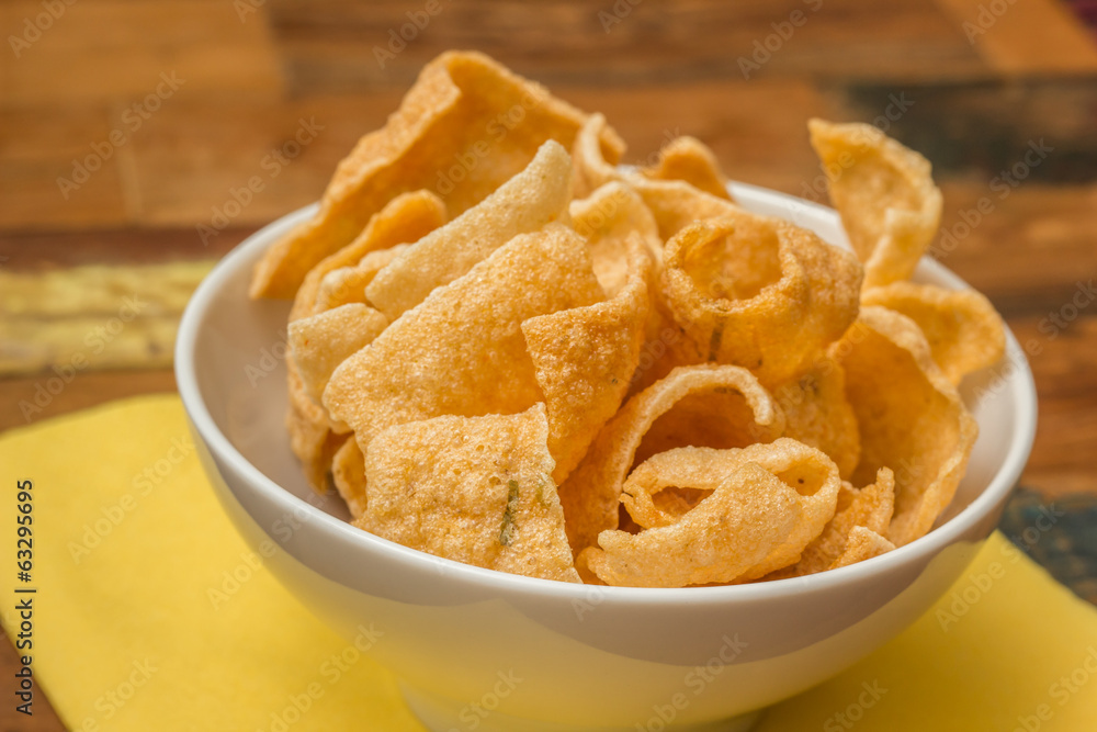 Traditional chinese prawn crackers in white bowl Traditional chinese prawn crackers in white bowl