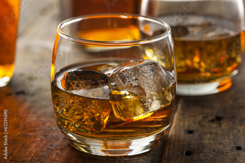 Alcoholic Whiskey Bourbon in a Glass with Ice