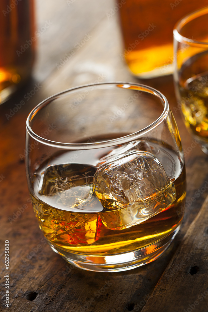 Alcoholic Whiskey Bourbon in a Glass with Ice