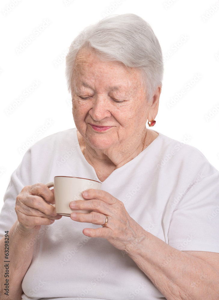 Old woman enjoying coffee or tea cup Old woman enjoying coffee or tea cup