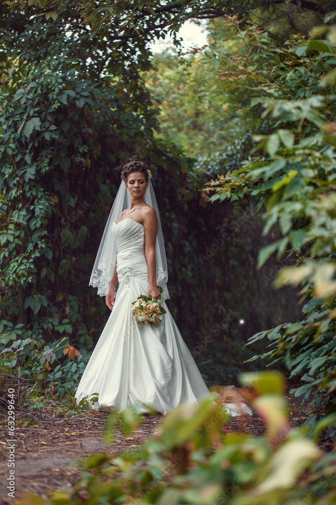 bride with a bouquet in the hand