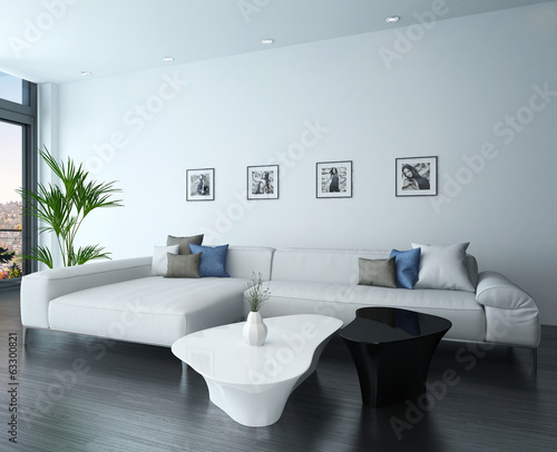 Living room interior with white couch and portraits on wall