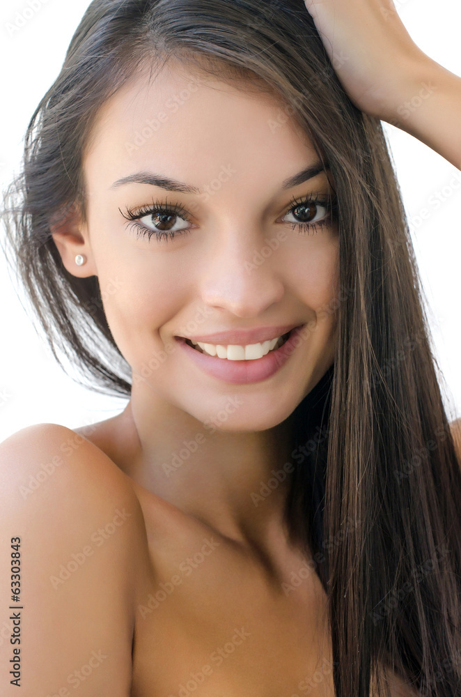 Portrait of a beautiful brunette girl with long hair smiling. Portrait of a beautiful brunette girl with long hair smiling.