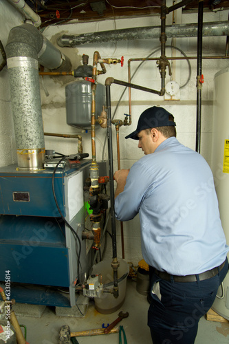 Plumber repairs furnace 