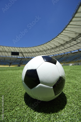 Football Soccer Ball on Green Grass Stadium Pitch © lazyllama