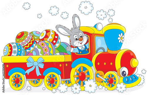 Bunny carries Ester eggs by toy train