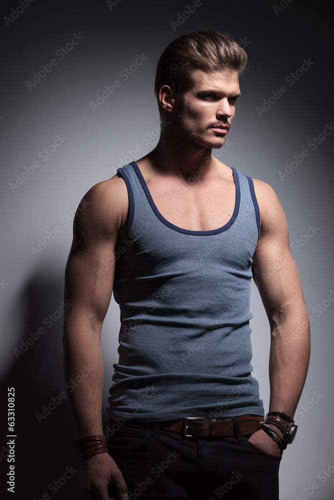 muscular man with hand in pocket muscular man with hand in pocket