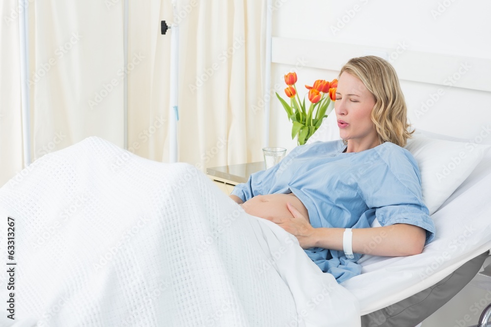 Woman suffering from labor pains Woman suffering from labor pains