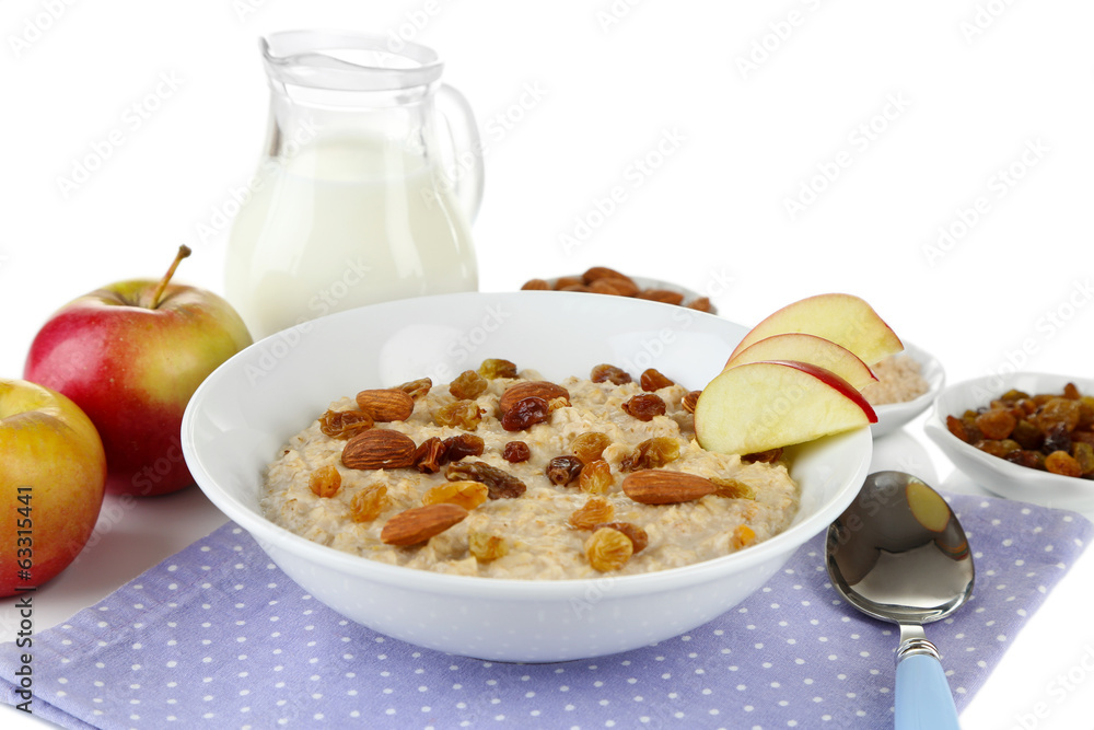 Tasty oatmeal with raisins and apples isolated on white Tasty oatmeal with raisins and apples isolated on white
