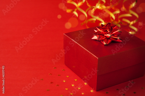 Christmas red gift box with glossy ribbon © pinkyone