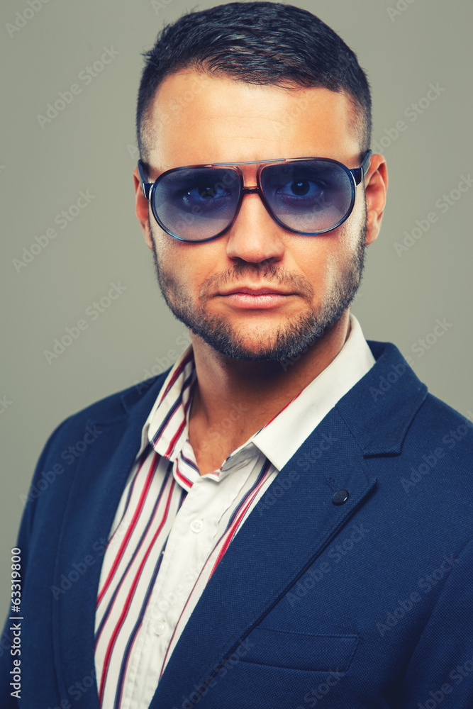 Man in a striped shirt in violet sunglasses Man in a striped shirt in violet sunglasses