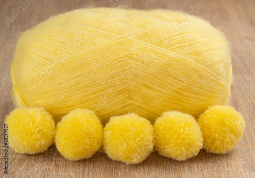 pompons and yellow yarn