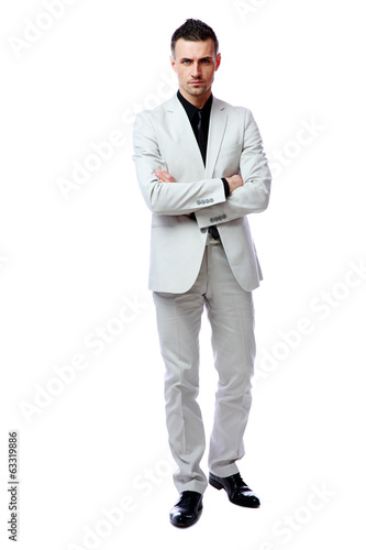 businessman standing with arms folded