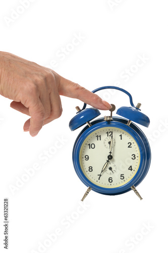 Hand and alarm clock