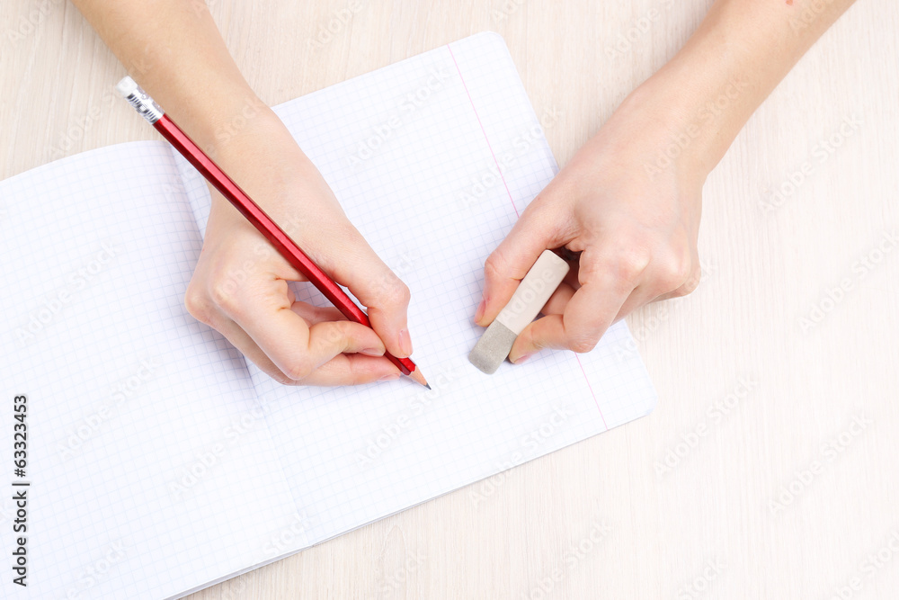 Human hands with pencil writing Human hands with pencil writing