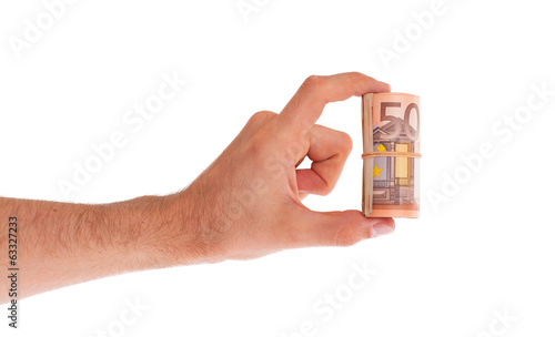 Roll of 50 euro bills in hand © michaklootwijk