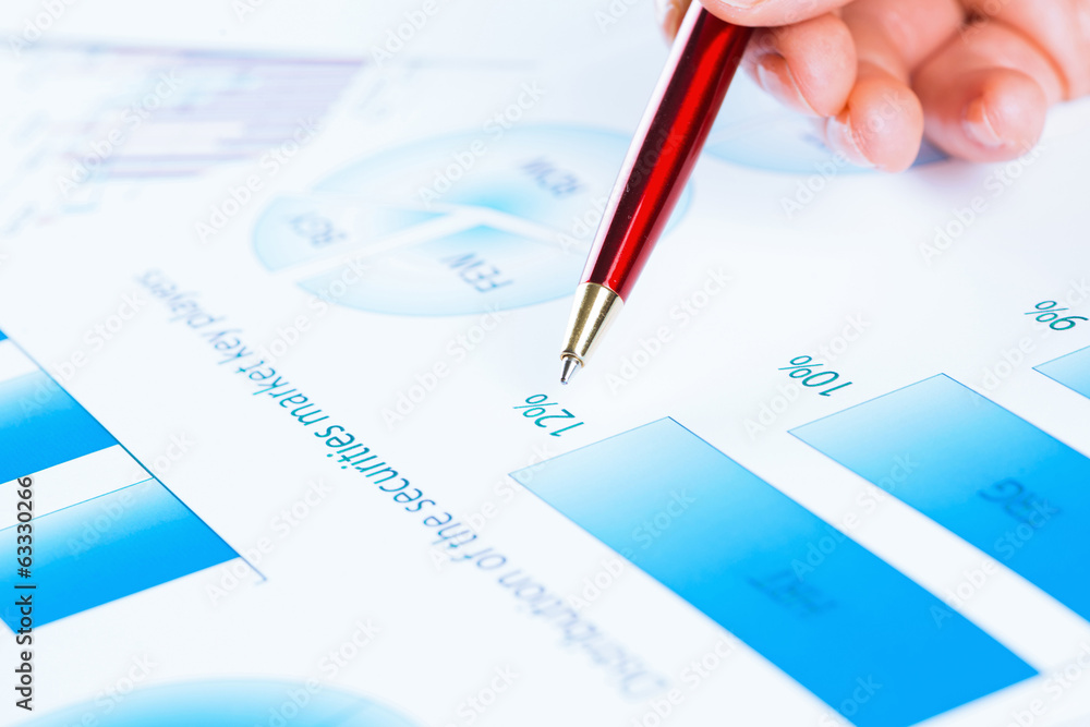 female hand pointing to the financial growth chart female hand pointing to the financial growth chart