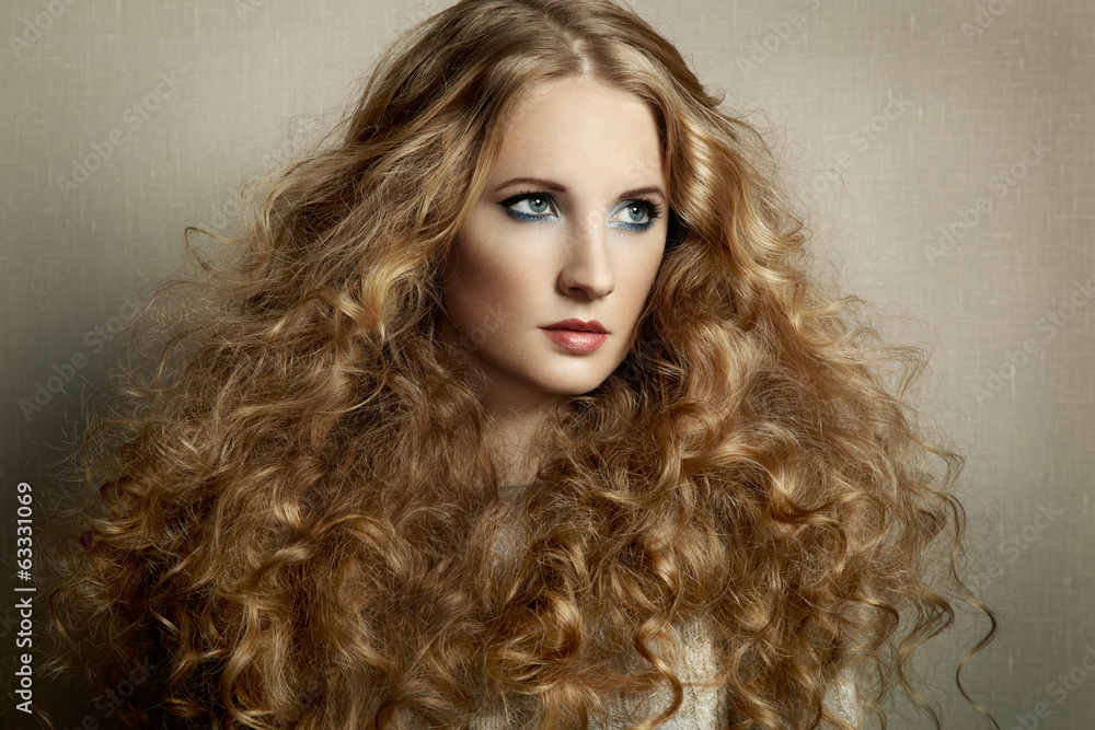 Portrait young beautiful woman with curly hair Portrait young beautiful woman with curly hair