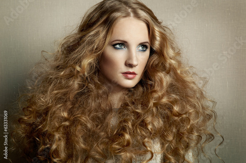 Portrait young beautiful woman with curly hair