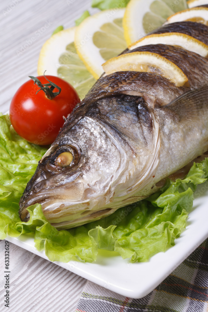 grilled sea bass with lemon, lettuce vertical macro grilled sea bass with lemon, lettuce vertical macro