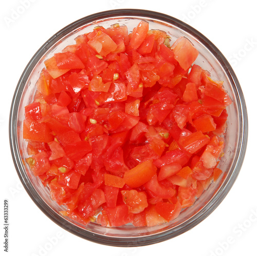 Glass Bowl of Diced Tomatoes with Top View Over White