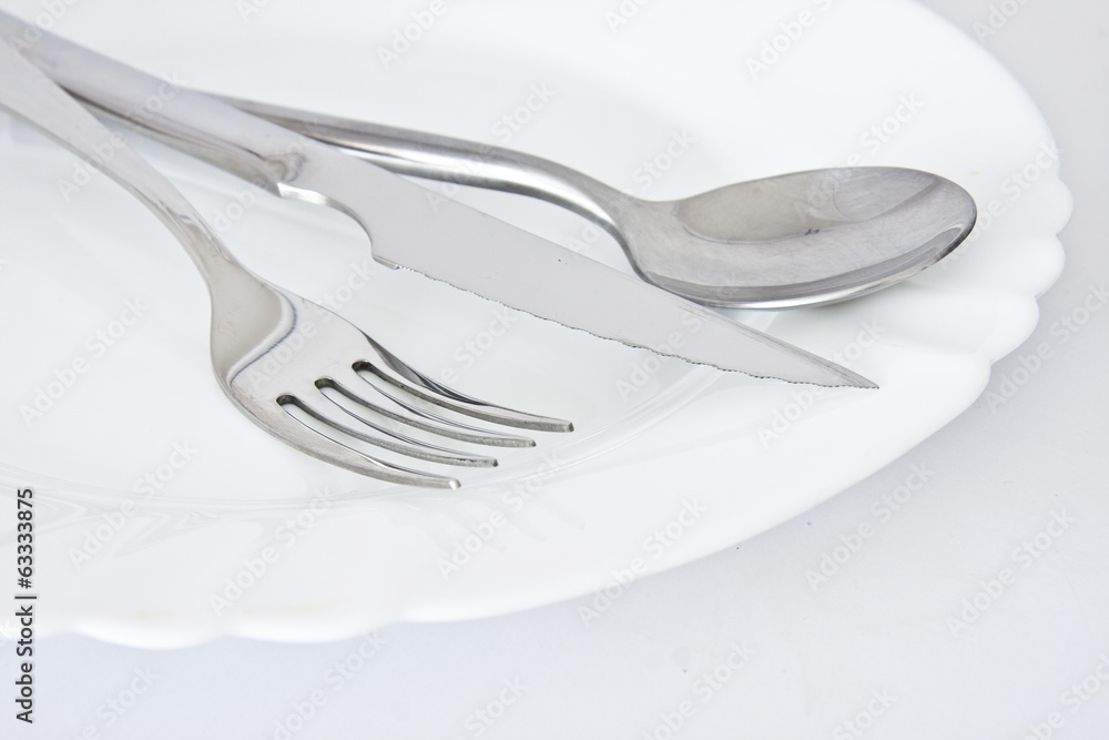 covered and spoon with ceramic plate on the table covered and spoon with ceramic plate on the table